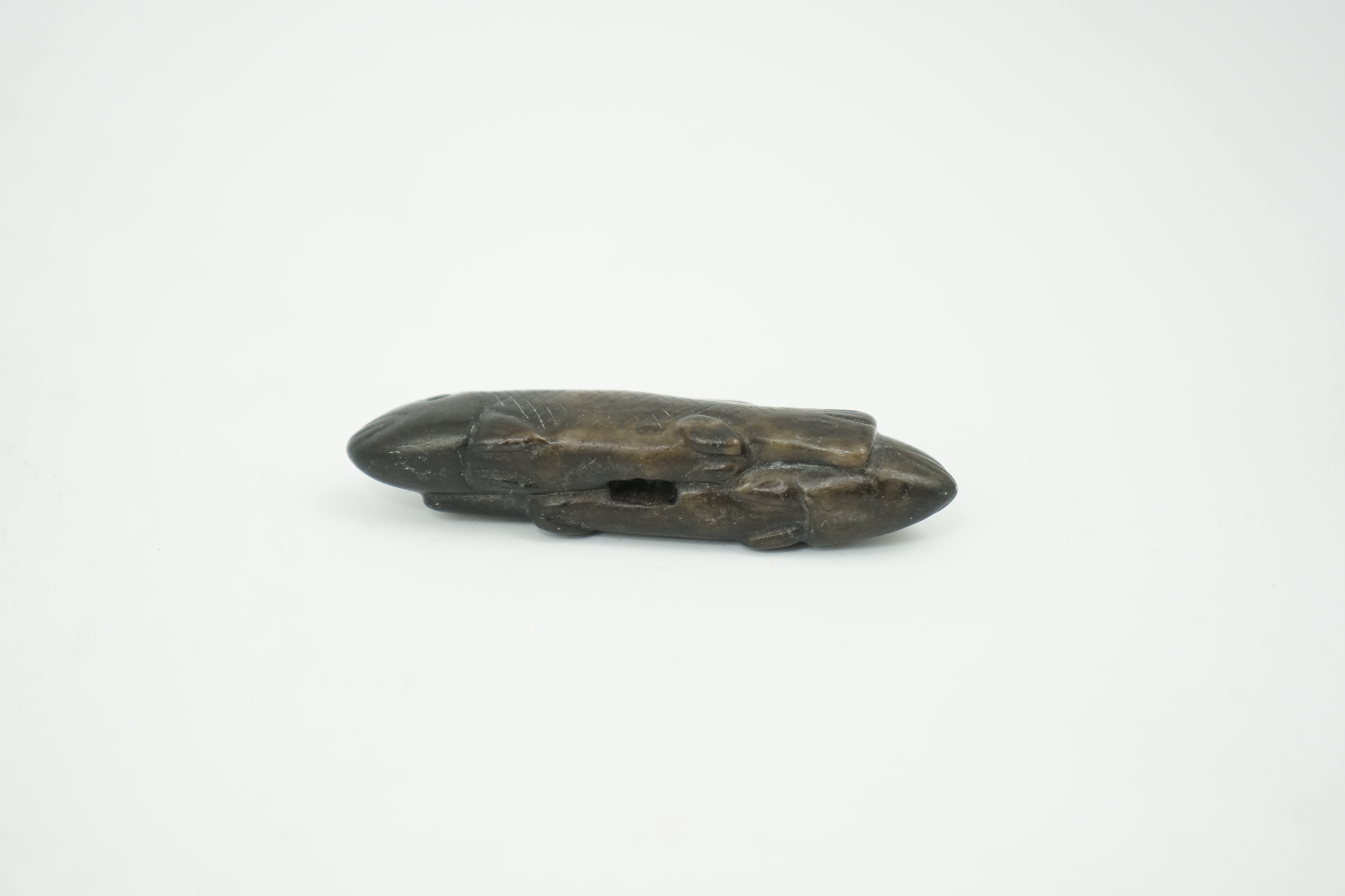 A Chinese black and white jade 'fish' sword fitting, Song or later